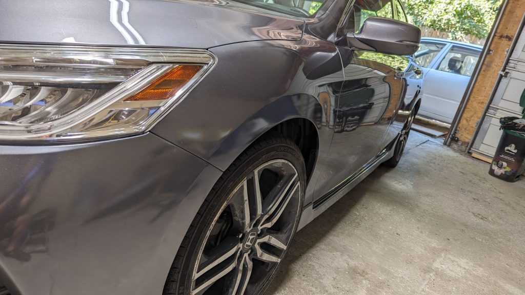 Grey Honda Accord front fender after repair