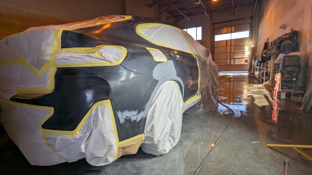 Rear quarter masked and primed in the paint booth