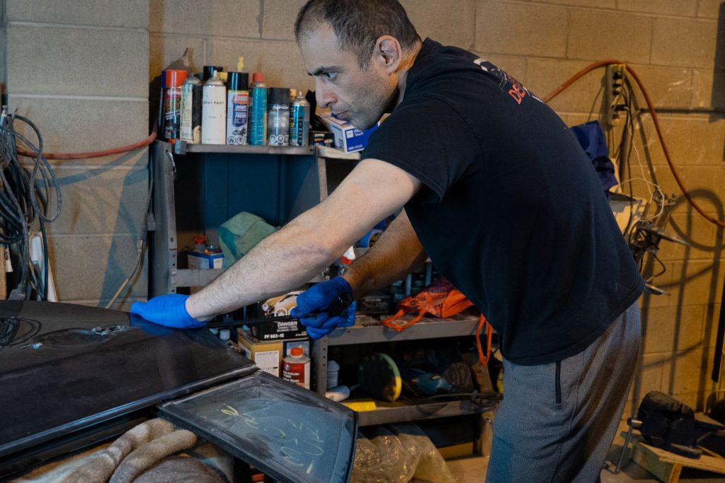 Pushing out a dent from behind with a PDR rod