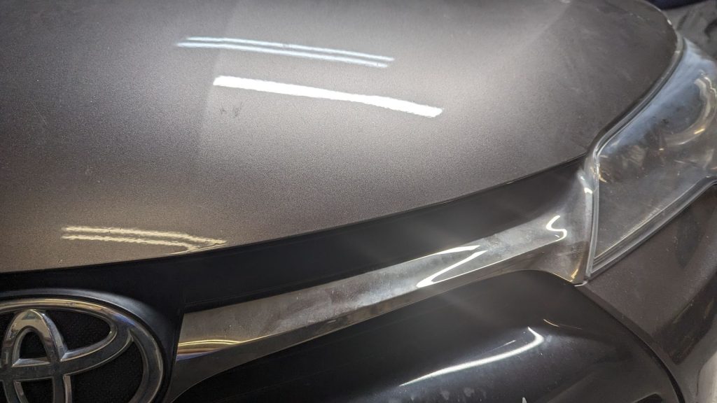 Grey Toyota hood after paintless dent repair