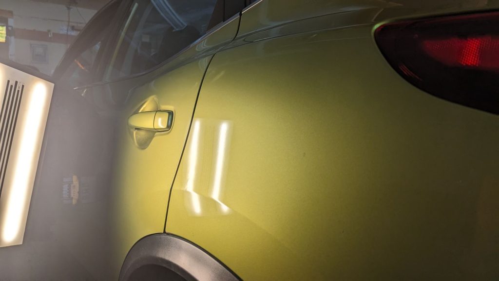 Yellow crossover rear quarter after paintless dent repair